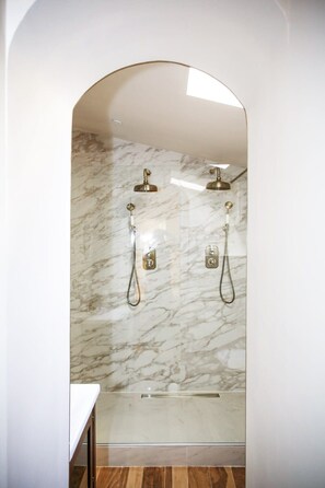 Shower, hair dryer, towels, shampoo