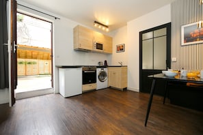 Fridge, microwave, stovetop, coffee/tea maker
