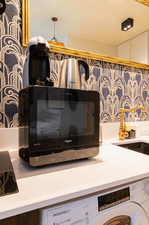 Fridge, microwave, stovetop, coffee/tea maker