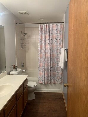 Combined shower/tub, towels, soap, toilet paper