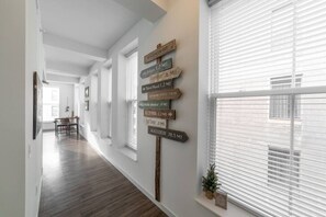 Explore local destinations from the comfort of our hallway, featuring signs to Wisconsin Ave, Lakeview, and Madison.