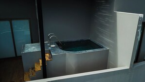 A modern bathroom with a built-in sink and a bathtub. - LUXURIOUS 2 STORY PH / PREMIUM AREA / PRIVATE PLUNGE POOL / HEART OF ALDEA ZAMA (Q.R.)