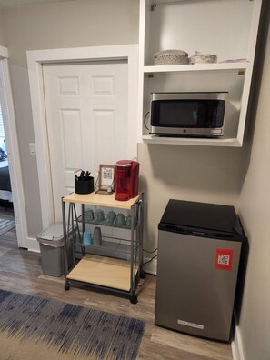 Prepare meals in this well-organized kitchenette with a refrigerator, microwave, and coffee maker.