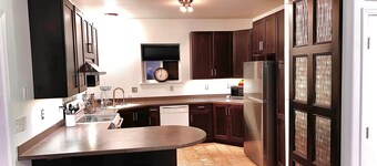 2 Bedrooms, Sleeps 6-8 with private deck, gym and game room. Near the trails. 