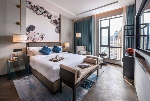 Suite Deluxe, 1 cama King size, para no fumadores | Edredón y artículos del minibar gratis 