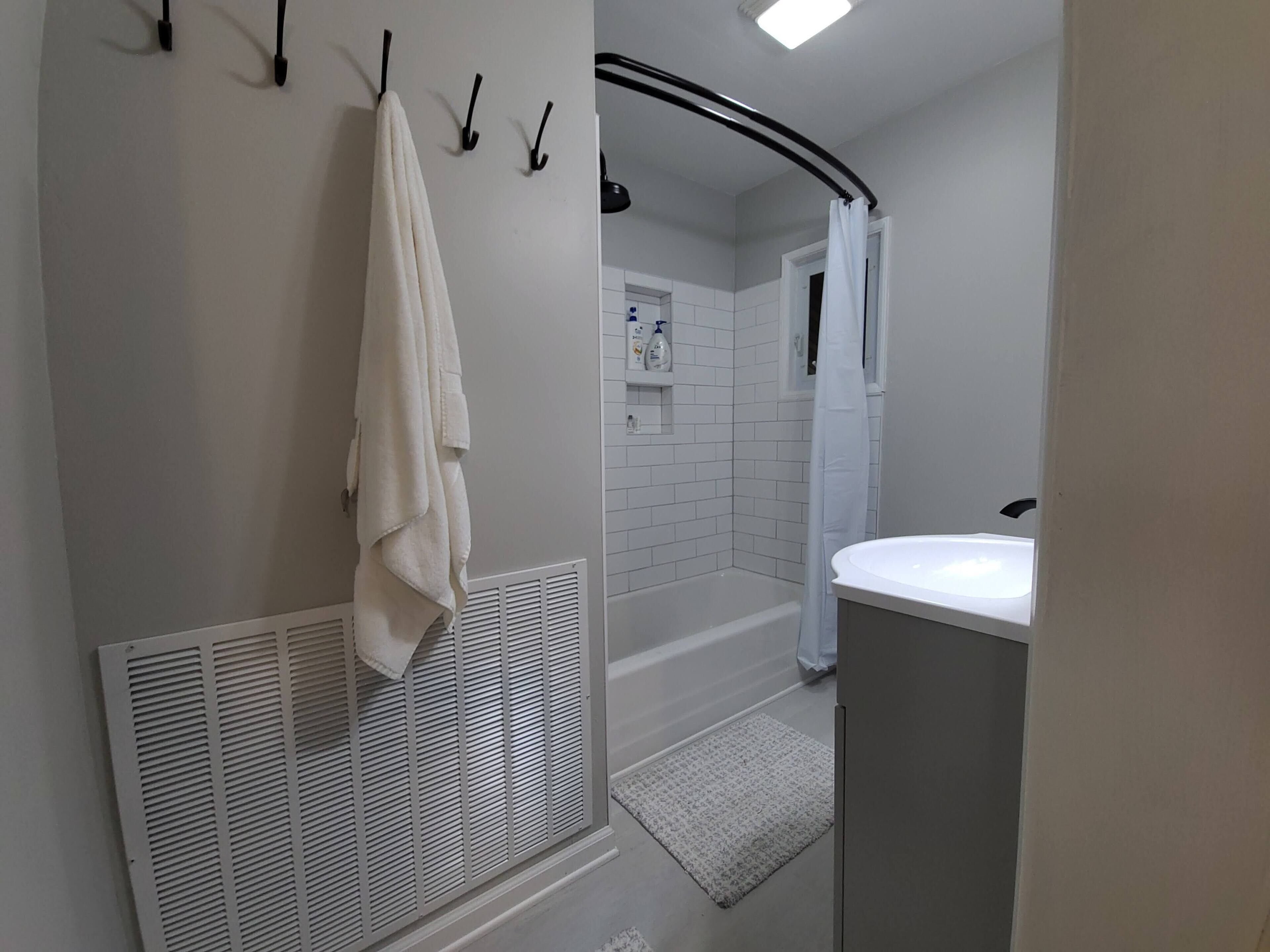 Combined shower/tub, hair dryer, towels, soap
