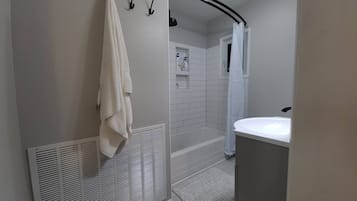 Combined shower/tub, hair dryer, towels, soap