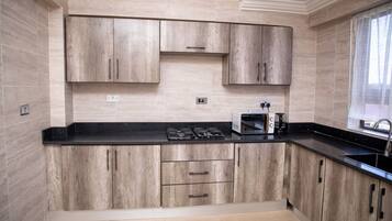 Apartment | Private kitchen | Fridge, microwave, oven, stovetop