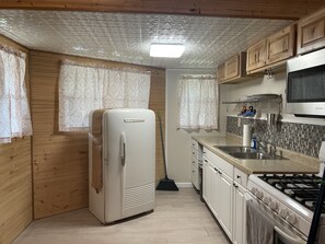 Fridge, microwave, stovetop, coffee/tea maker