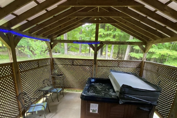 Outdoor Covered hot tub Located off of the master bedroom!