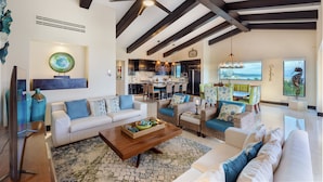 A spacious living area with a high ceiling, a dining area, and a kitchen. - Ocean View Hacienda de Mita Penthouse, Premier Golf  (Punta de Mita)