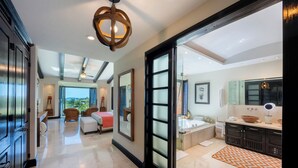 A spacious bathroom with a large bathtub, a vanity with a mirror, and a shower area. - Ocean View Hacienda de Mita Penthouse, Premier Golf  (Punta de Mita)