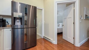 A modern kitchen with a stainless steel refrigerator, a coffee maker, and a water dispenser. - The Nest-Cozy Retreat Near Portsmouth +Ogunquit, Full kitchen, close to every... (York)
