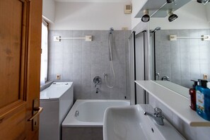 Bathtub, hair dryer, towels