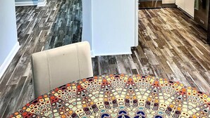 A modern kitchen with white cabinets, a stainless steel range, and a microwave. - Comfortable Open Space. Pets are allowed (Beaufort)