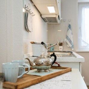 Fridge, stovetop, coffee/tea maker, electric kettle