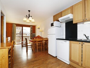 Fridge, microwave, coffee/tea maker, cookware/dishes/utensils