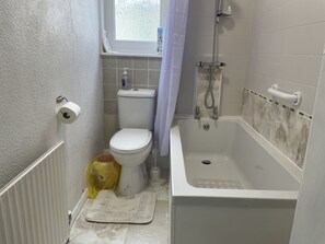 Bathtub, hair dryer, towels