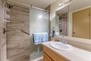 Shower, towels, shampoo, toilet paper