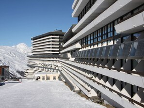 Experience the unique architectural design of this mountain hotel, featuring expansive balconies and large windows.