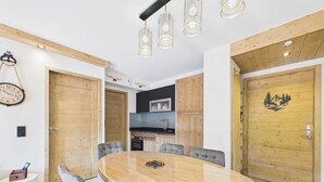 A modern kitchen with wooden cabinets, a microwave, and a sink.
