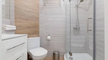 Shower, hair dryer, towels, shampoo