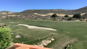 A golf course with a clear sky, green grass, sand bunkers, and rocky hills in the background. - Holiday Home "Los Almendros" with Shared Pool, Terrace & Wi-Fi (Vera)