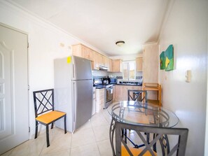 Fridge, cookware/dishes/utensils, dining tables