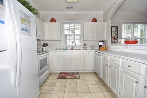 Fridge, microwave, oven, stovetop - 521 Arbor Trace - Barefoot Resort Rentals (North Myrtle Beach)