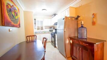 Fridge, cookware/dishes/utensils, dining tables