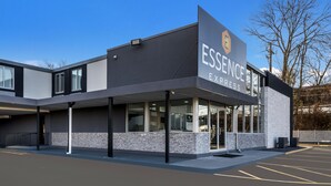 A modern building with a sign reading "ESSENCE EXPRESS".