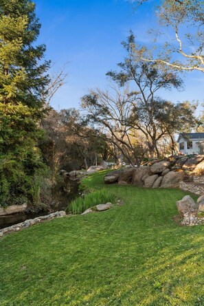 The home has a year round creek flowing through the property - 2-acre Modern Boho Creekside Country Retreat (sleeps 14) (Loomis)