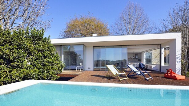 A modern house with a swimming pool, large glass windows, and a wooden deck. - Caminha Views - Two Bedroom Villa, Sleeps 4 (Moledo)