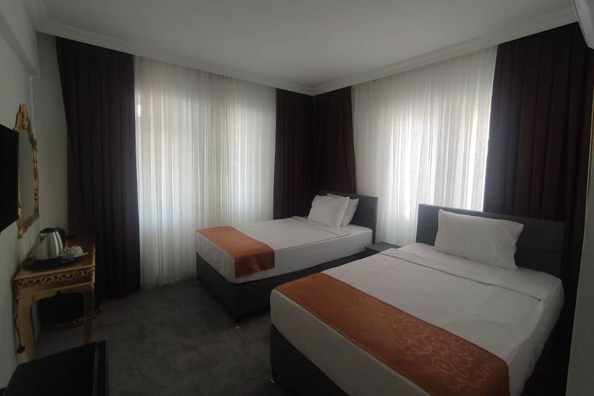 Premium bedding, down duvets, minibar, laptop workspace