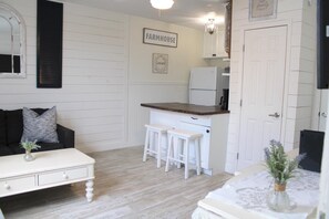 Flat-screen TV - Cozy Beachside Cottage Studio (New Smyrna Beach)