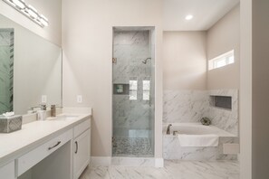 Combined shower/tub, hair dryer, towels, soap