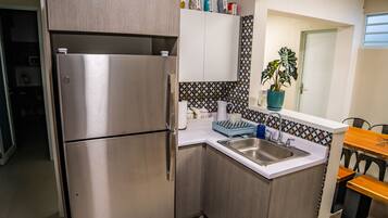 Fridge, microwave, stovetop, coffee/tea maker