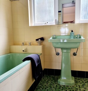 Bathtub, hair dryer, towels, soap