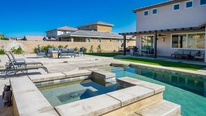 A residential area with a swimming pool, outdoor furniture, and a patio area. - Beautiful 5 BR house with Olympic size Pool and SPA in Indio (Indio)