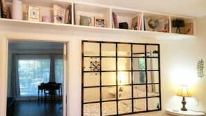 A room with a large window, a piano, a mirror, and a lamp. - Old Farm Land by Willamette River Oak Trees Bike Path Shopping Restaurants (Eugene)