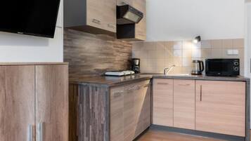 Fridge, microwave, cookware/dishes/utensils