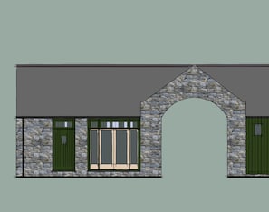 Stunning building with a large arched entrance and two entrance doors.