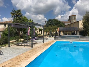 Seasonal outdoor pool, open 11:00 AM to 7:30 PM, pool umbrellas