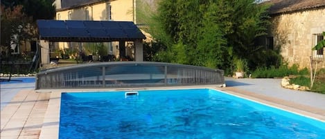 Seasonal outdoor pool, pool umbrellas, pool loungers