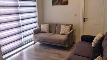 Family Room | Minibar, in-room safe, laptop workspace, soundproofing