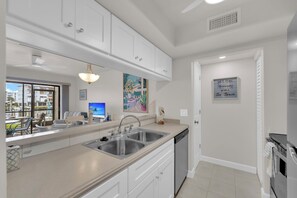 Private kitchen - Escape To Sun And Sand!  Cozy Island Waterfront Condo! Walk to Beach, Pool, Great Fishing! (Fort Myers Beach)