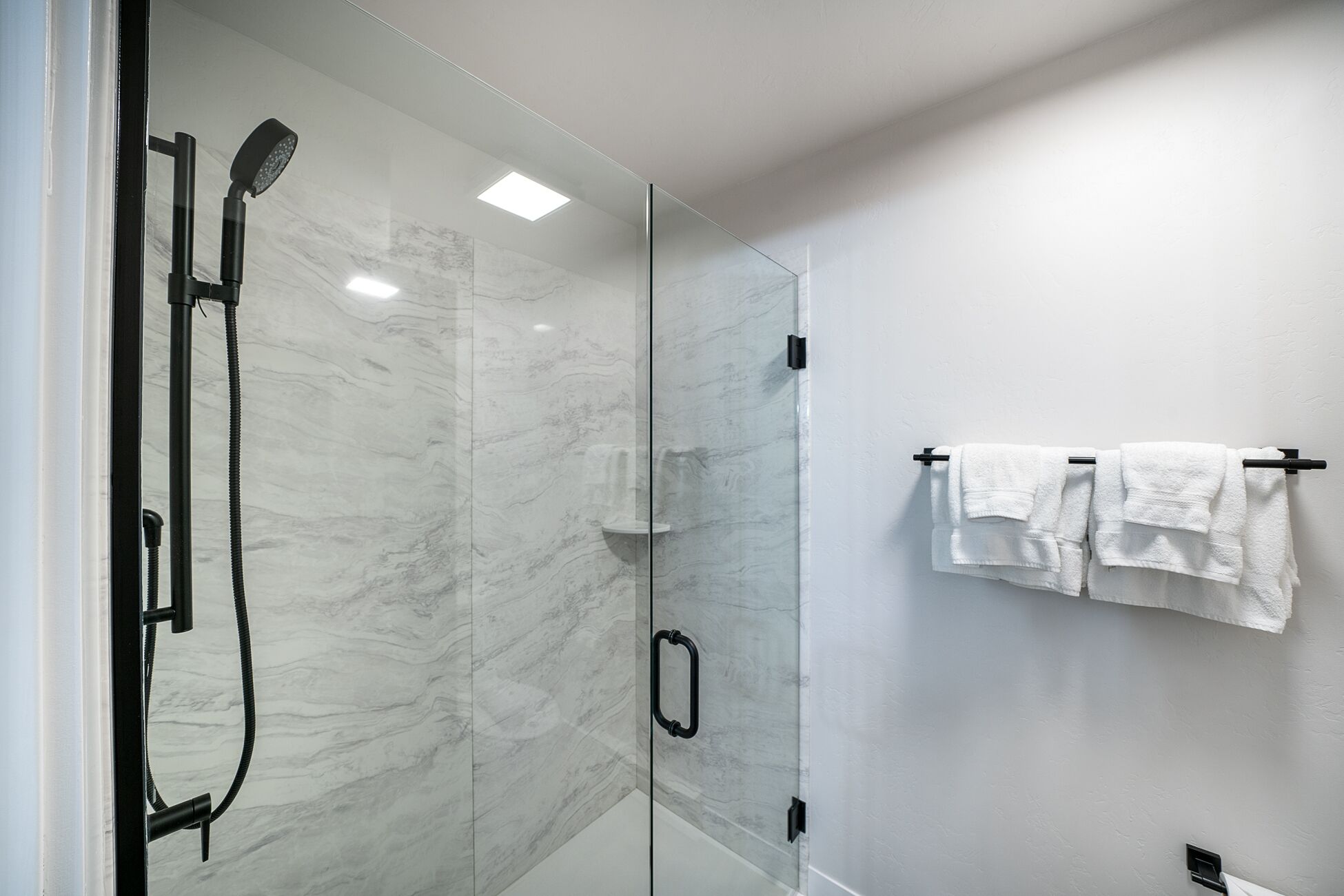 Shower, towels, shampoo, toilet paper