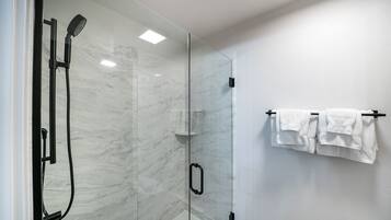Shower, towels, shampoo, toilet paper