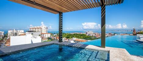 A lap pool, pool loungers