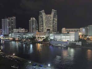 Waterfront hotel with a unique, angular design, situated along a body of water with marina access.